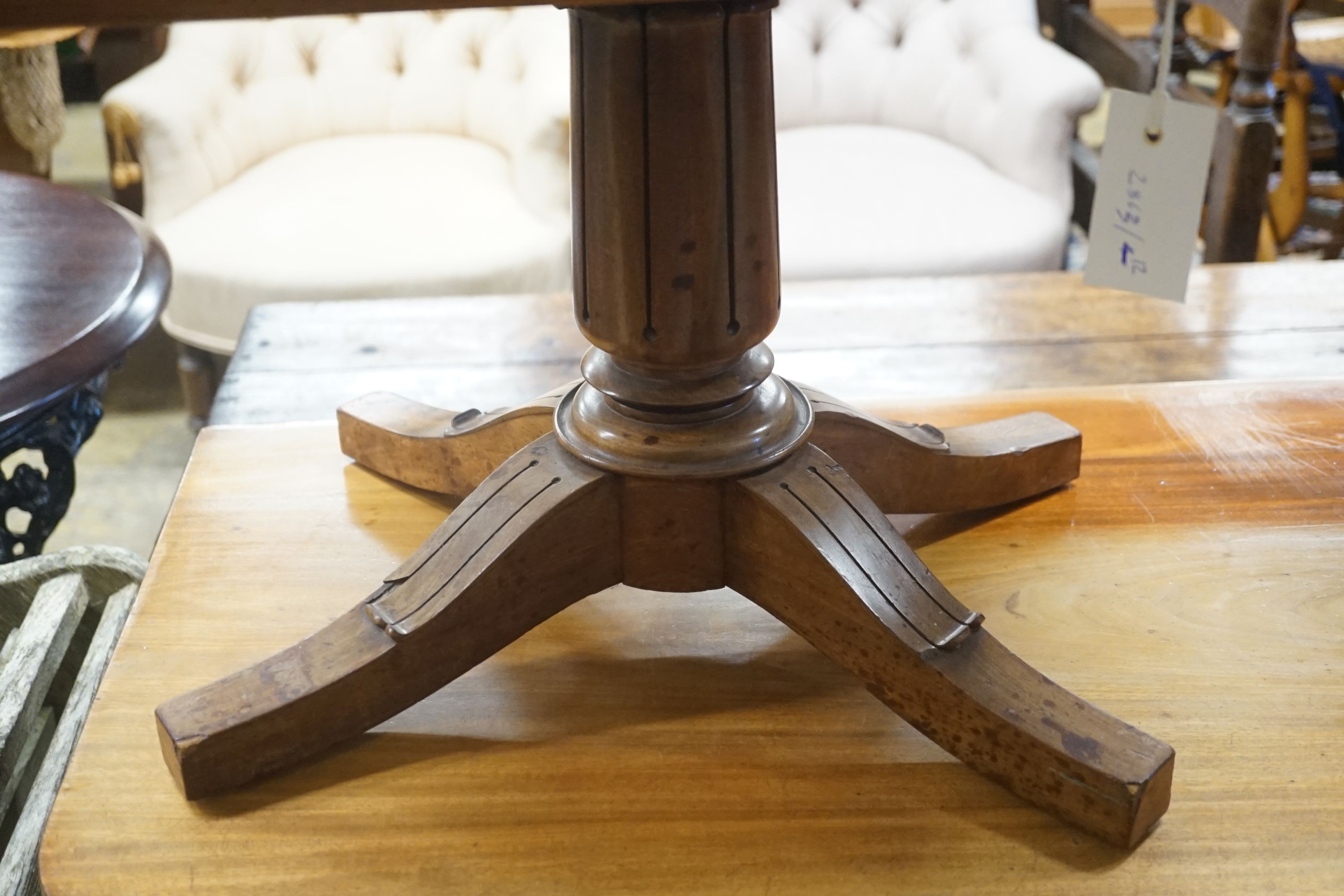 A miniature mahogany tablet-topped table, width 56cm depth 40cm height 38cm